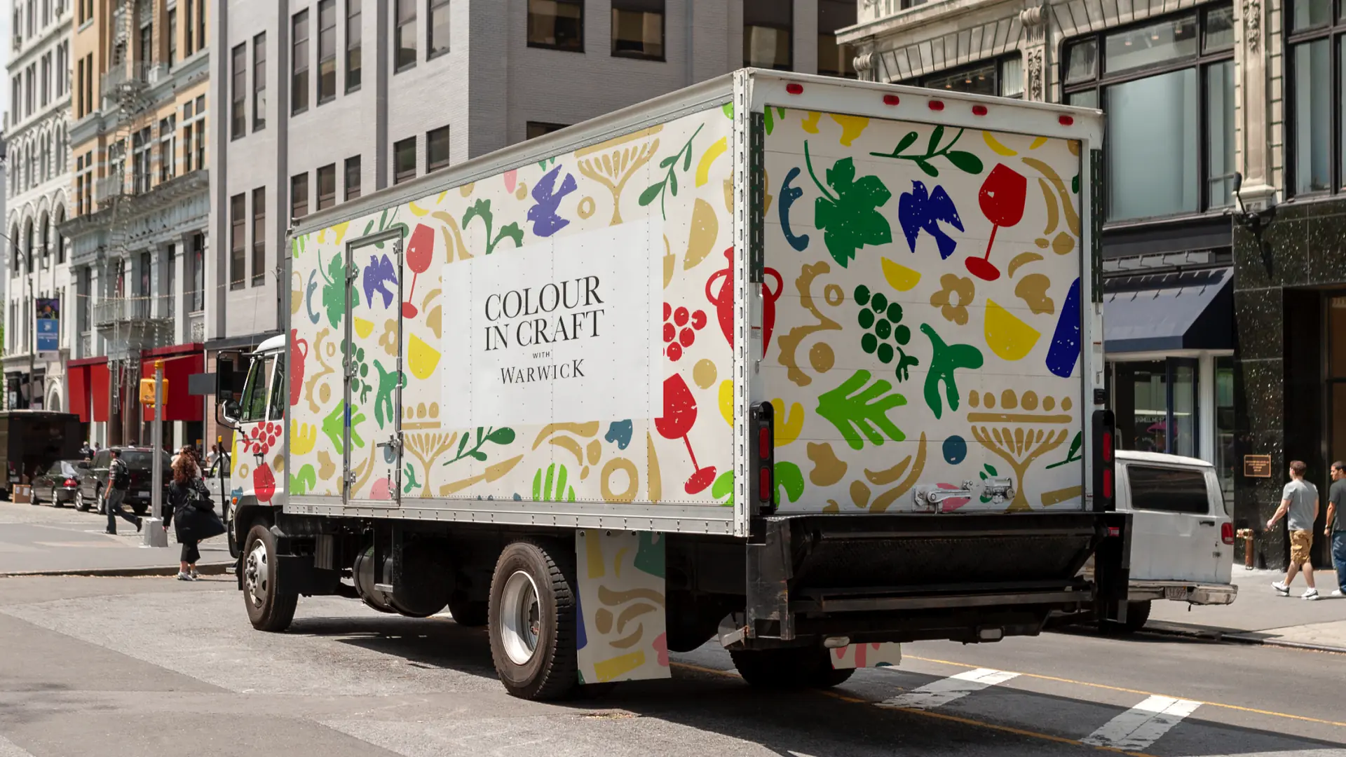 Delivery truck wrapped in the Colour in Craft pattern on a city street